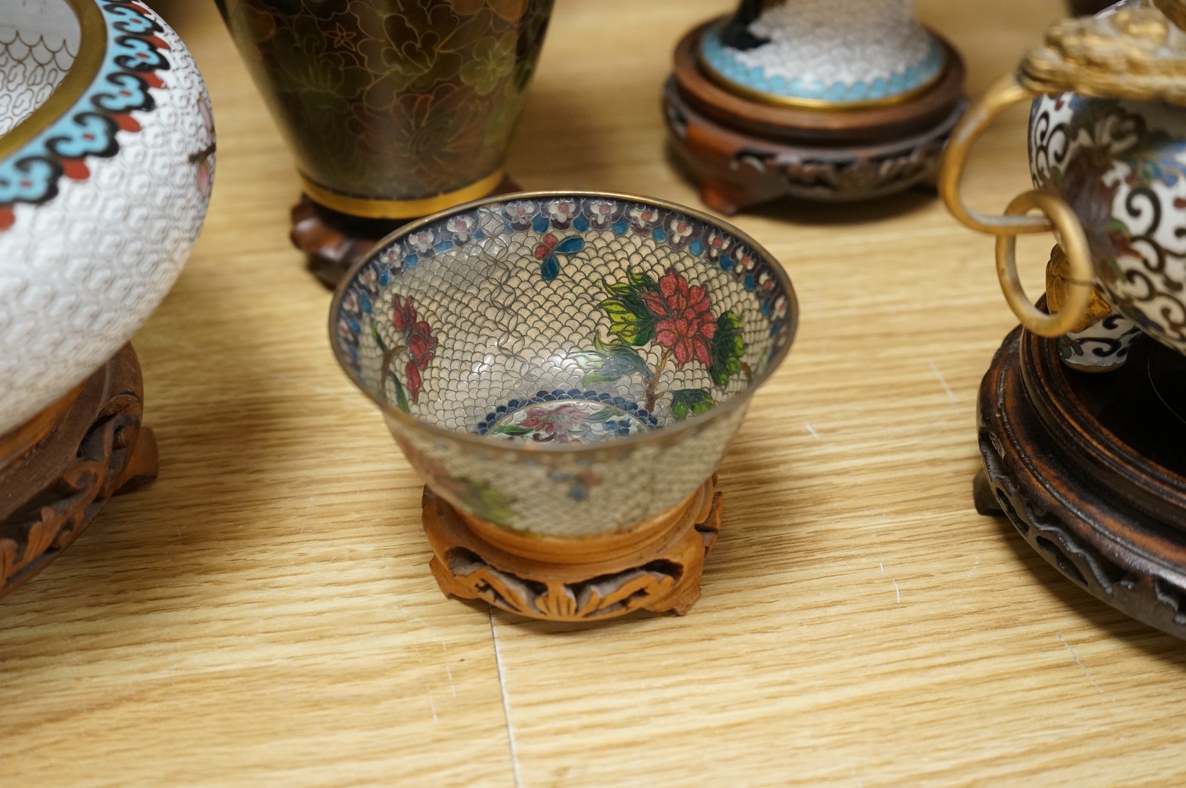 A plique a jour enamel tea bowl together with a collection of cloisonné enamel vases, bowls etc., tallest 26cm